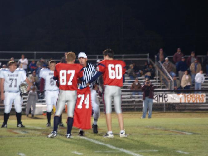 Captains carring Christopher jersey out for coin toss